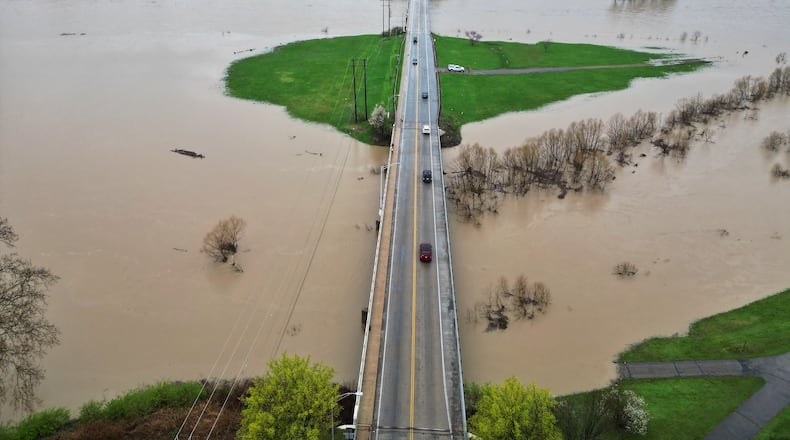 The level of the Great Miami River is up after several days of heavy rain Saturday, April 5, 2025 near the Ohio 122 bridge in Middletown. NICK GRAHAM/STAFF