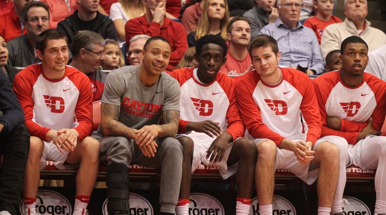 Dayton seniors Kyle Davis, Jeremiah Bonsu and Joey Gruden smile for the camera during the second half. David Jablonski/Staff