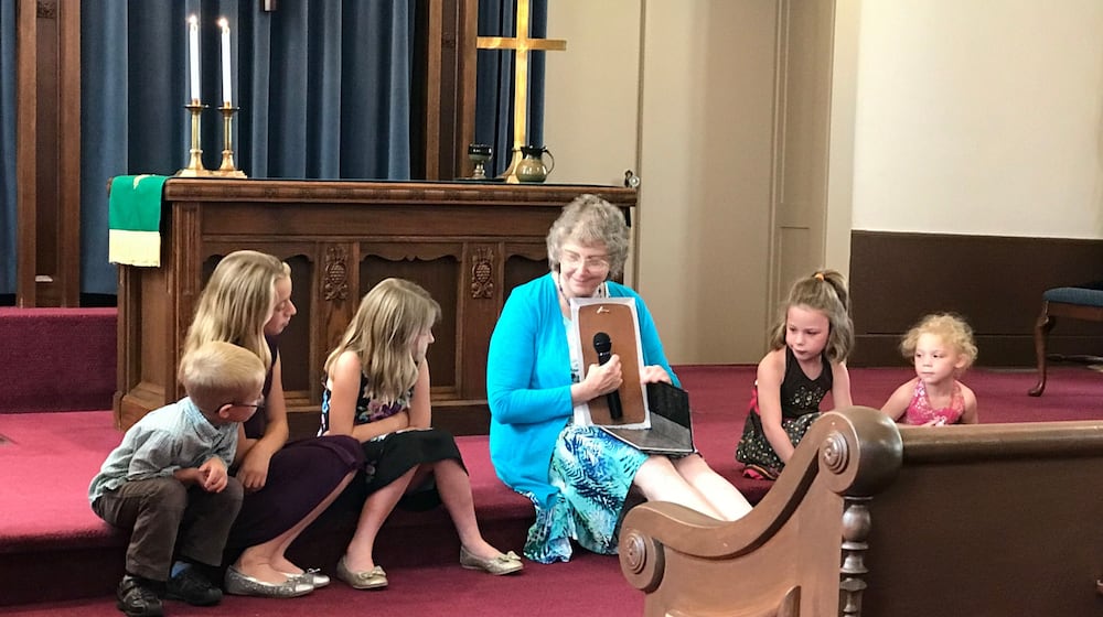 Rev. Shelley Wiley leads a children's service at New Carlisle’s Honey Creek Presbyterian Church, 212 Jefferson St., which will have its final service and a special celebration of its 221 years of service beginning at 3:30 p.m. Sunday, Nov. 30. CONTRIBUTED