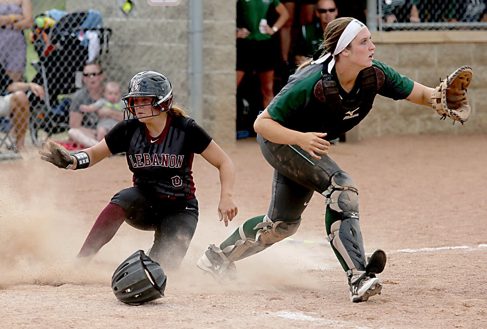 Lebanon’s Chloe Allen scores a run as Mason catcher Brooke Rice waits for the throw Sunday during a Division I regional final at Kings. CONTRIBUTED PHOTO BY E.L. HUBBARD