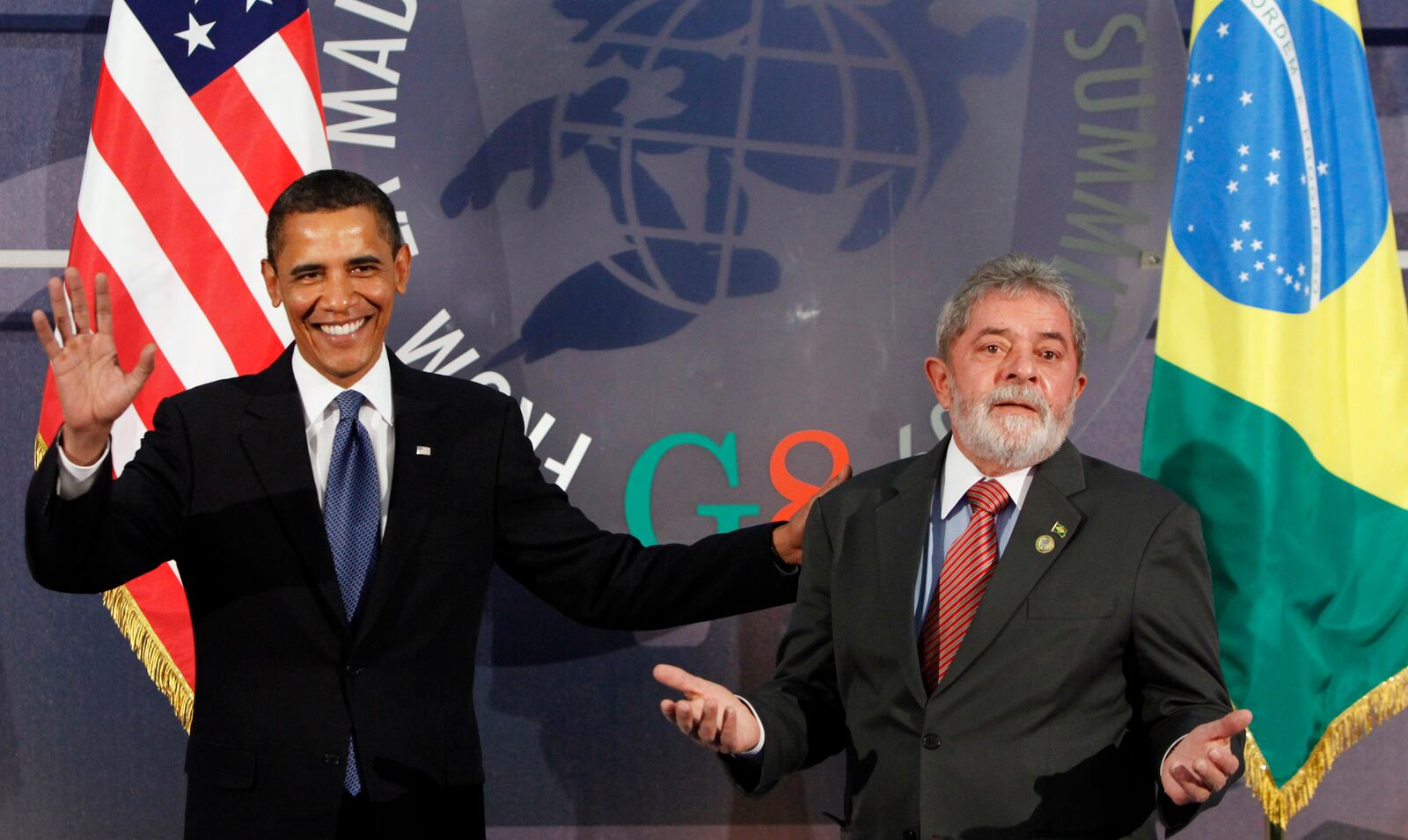 FILE - U.S. President Barack Obama, left, and Brazil's President Luiz Inacio Lula da Silva, react during the G8 Summit in L'Aquila, Italy, July 9, 2009. (AP Photo/Haraz N. Ghanbari, File)