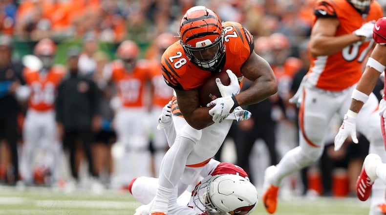 CINCINNATI, OH - OCTOBER 6: Joe Mixon #28 of the Cincinnati Bengals is tackled by Jalen Thompson #34 of the Arizona Cardinals during the first quarter at Paul Brown Stadium on October 6, 2019 in Cincinnati, Ohio. (Photo by Kirk Irwin/Getty Images)