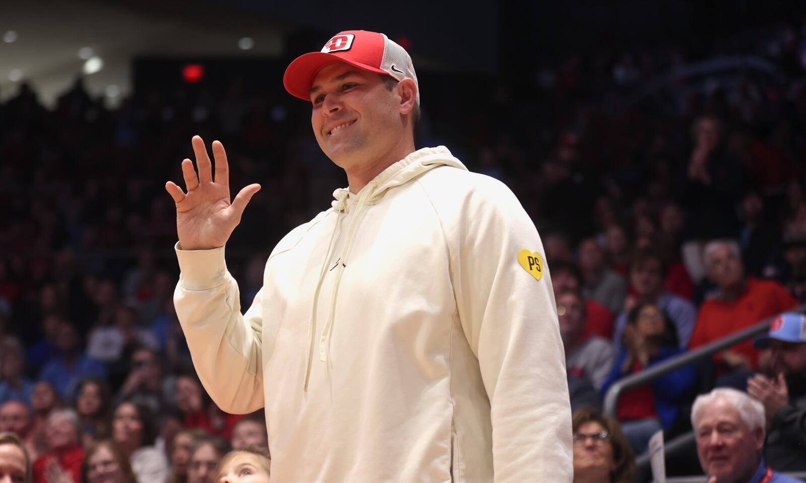 Former UD pitcher Craig Stammen, the new manager of the San Diego Padres, is honored during Dayton's game against Liberty on Saturday, Dec. 20, 2025, at UD Arena. David Jablonski/Staff