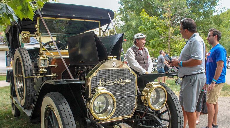 Michael Howard of Scotts, Michigan, wearing cap, talks about his 1911 Stoddard-Dayton to spectators during the Dayton Concours. The car was built in Dayton. Photo by Haylie Schlater