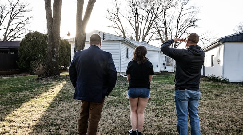 Keller Williams realtor, Tyler Blatt, left, shows a Beavercreek home Thursday February 23, 2023. Sales of single-family homes dropped in January, according to Dayton Realtors Multiple Listing Service. JIM NOELKER/STAFF