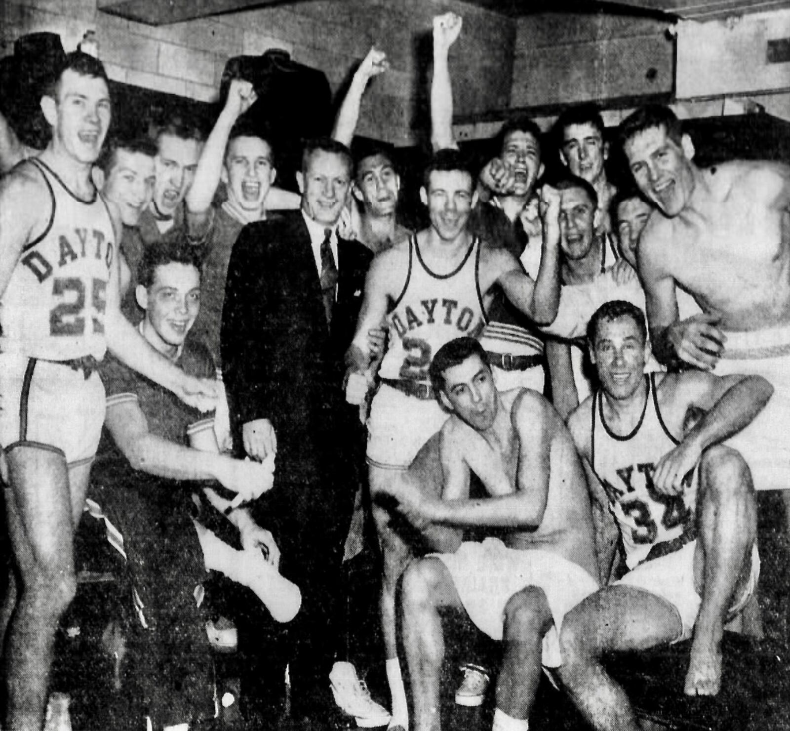Dayton celebrates after a victory against No. 4 Duquesne on Feb. 26, 1955, in Dayton. Daily Daily News photo