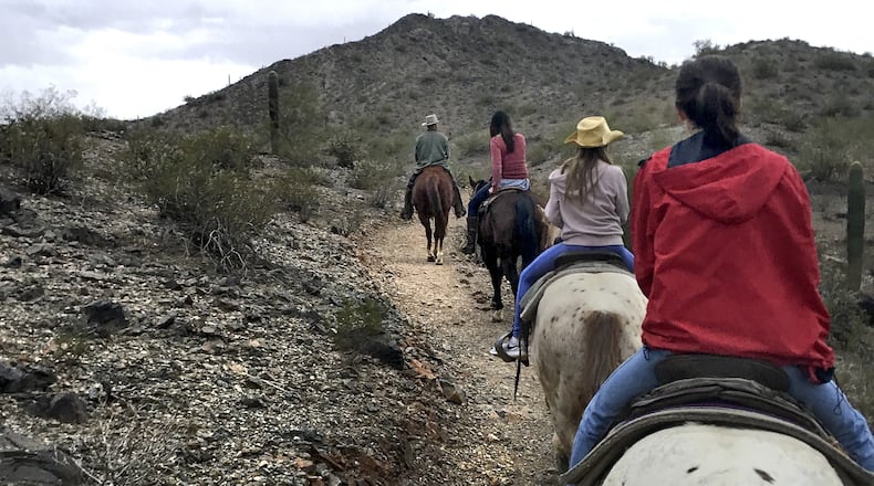 Riders wend their way along a trail through Estrella Mountain Regional Park. (Sue Campbell/Minneapolis Star Tribune/TNS)