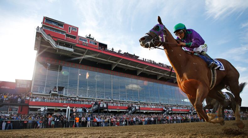 California Chrome, ridden by jockey Victor Espinoza, wins the 139th Preakness Stakes horse race at Pimlico Race Course, Saturday, May 17, 2014, in Baltimore. (AP Photo/Matt Slocum)