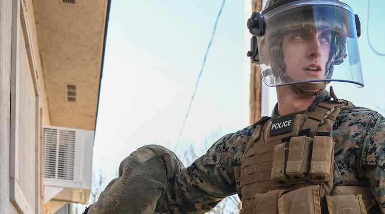 Lance Corp. Colton Sabrowski, Charlie Company, 4th Law Enforcement Battalion Wright-Patterson Air Force Base searches Senior Airman Scott Araujo, 445th Security Forces Squadron, WPAFB, for any dangerous or unlawful items during a training exercise at the Warfighter Training Center March 6. Both Marines and Airmen participated in the detainee operations training adding elements of experience from each branch of service providing total force integration. U.S. AIR FORCE PHOTO/MASTER SGT. PATRICK O’REILLY