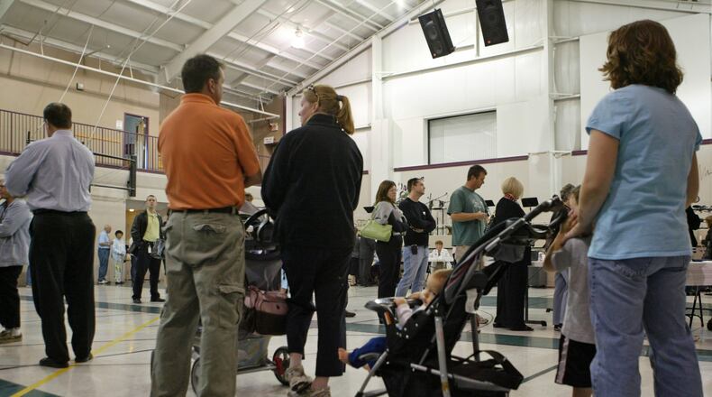 More than 19,000 Warren County voters will be sent to a new polling place for the November election. In 2008, voters stood in line at Grace Baptist Church in Mason. STAFF/LINDA WEISENBORN
