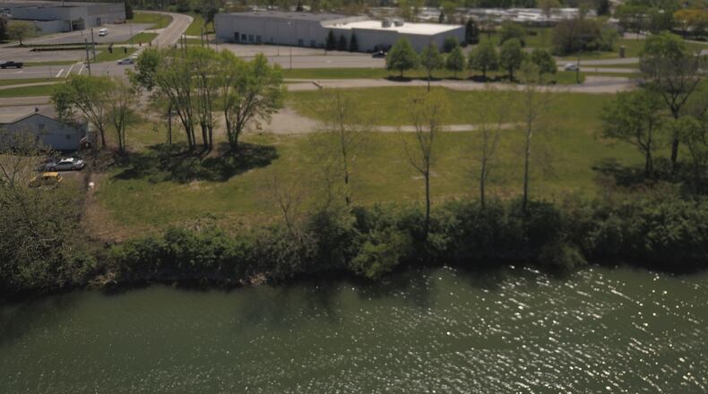 The city of West Carrollton wants to tear down three buildings it owns on the Great Miami River. It wants to hire the same company tearing down the former Carrollton Plaza, seen here in an earlier photo. STAFF