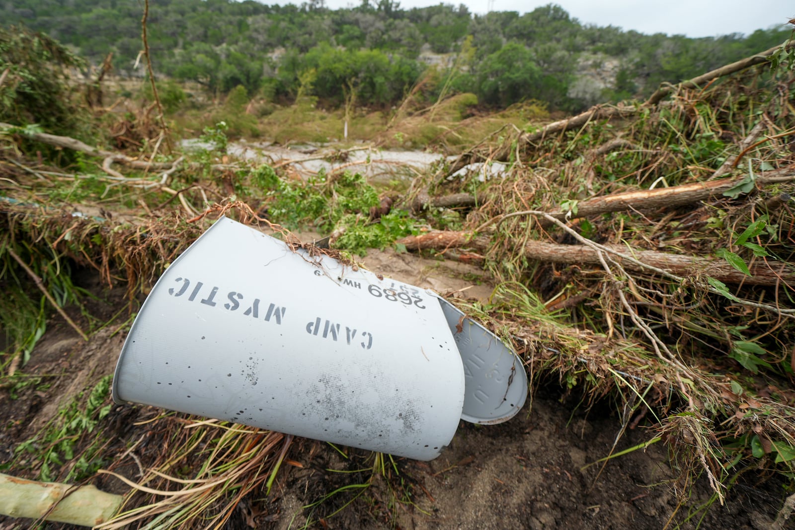 A Camp Mystic mailbox is seen near the entrance to the establishment along the banks of the Guadalupe River after a flash flood swept through the area Saturday, July 5, 2025, in Hunt, Texas. (AP Photo/Julio Cortez)