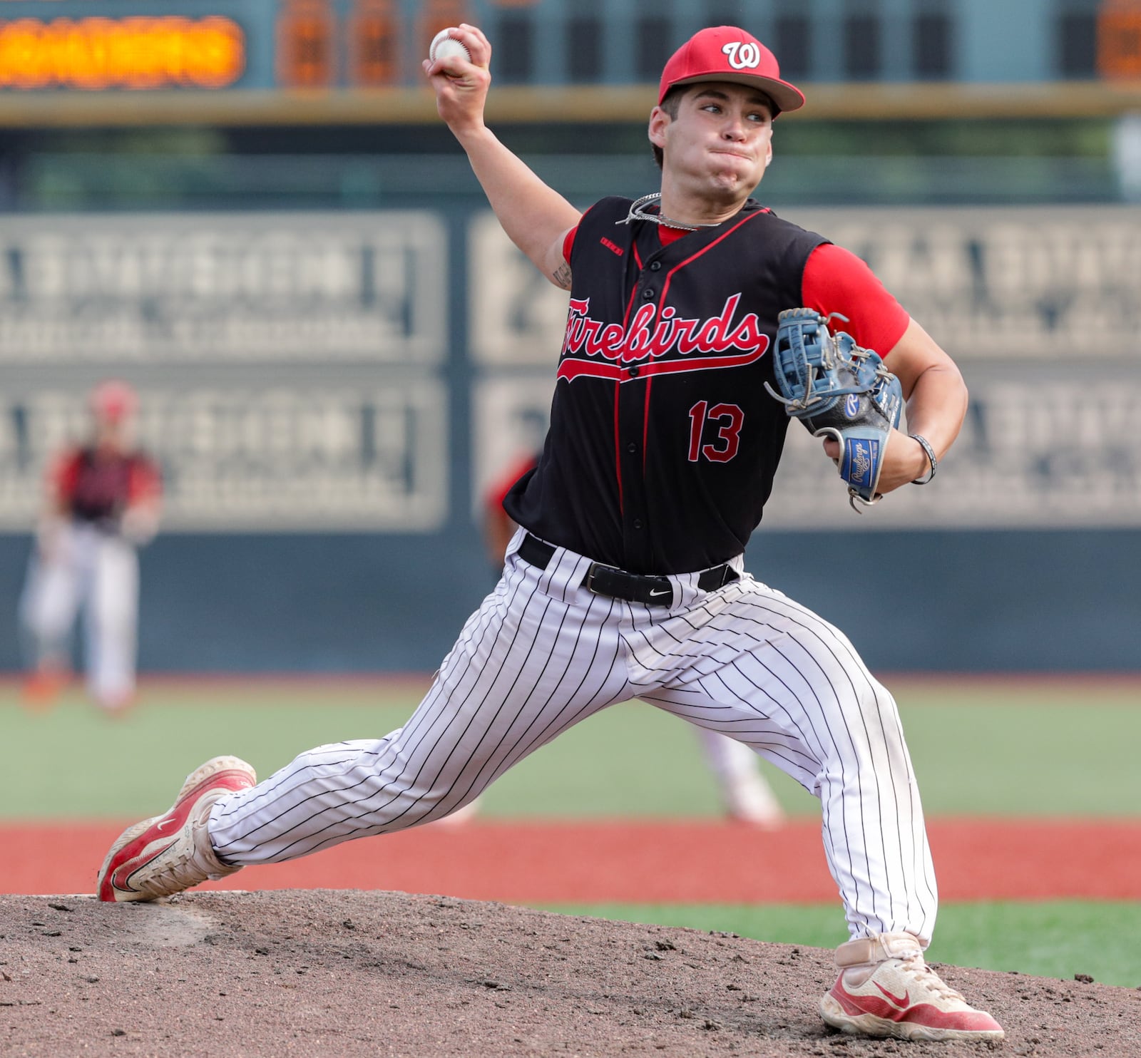 Lakota West senior pitcher Adrian Smith throws during a 3-2 win over Cincinnati Moeller in a Division I regional final on Wednesday at Wright State University's Nischwitz Stadium. Smith threw a complete game and gave up two hits while striking out nine batters. BRYANT BILLING / STAFF