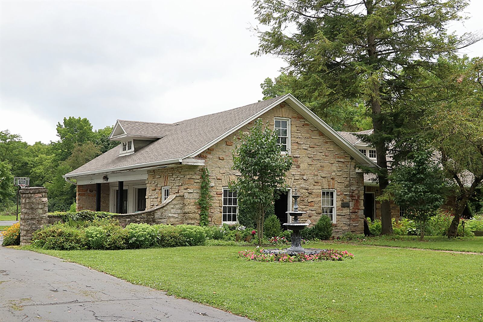 The property includes a stack-stone carriage house with six bays, storage, tack room and half bath. CONTRIBUTED PHOTO BY KATHY TYLER