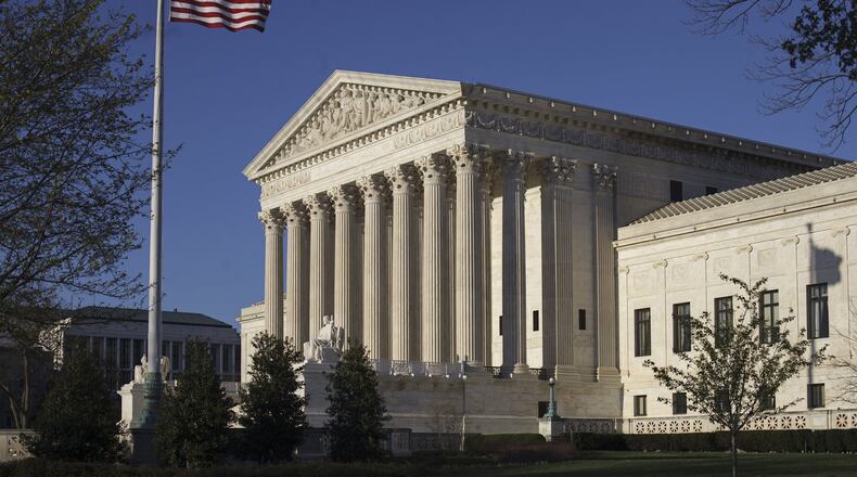 In this April 4, 2017 file, the Supreme Court in Washington. The Supreme Court says the government can’t refuse to register trademarks that are considered offensive. The ruling Monday, June 19, 2017, is a win for an Asian-American rock band called the Slants and it gives a major boost to the Washington Redskins in their separate legal fight over the team name. (AP Photo/J. Scott Applewhite)