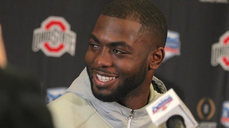 Ohio State’s J.T. Barrett talks to reporters at Fiesta Bowl Media Day on Thursday, Dec. 29, 2016, at the Camelback Inn. David Jablonski/Staff