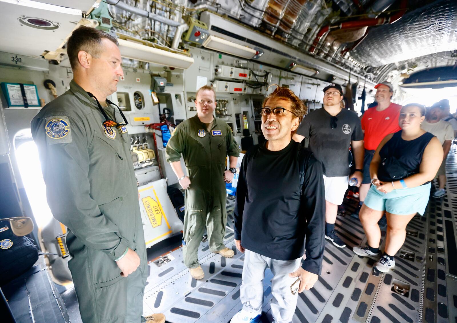 Takashi Morikawa traveled from Himeji, Japan, to attend the Dayton Air Show as he celebrated his retirement. He toured this C-17 aircraft with guidance from Air Force TSgts. Jay Benedict and Zach Webb. CORNELIUS FROLIK / STAFF