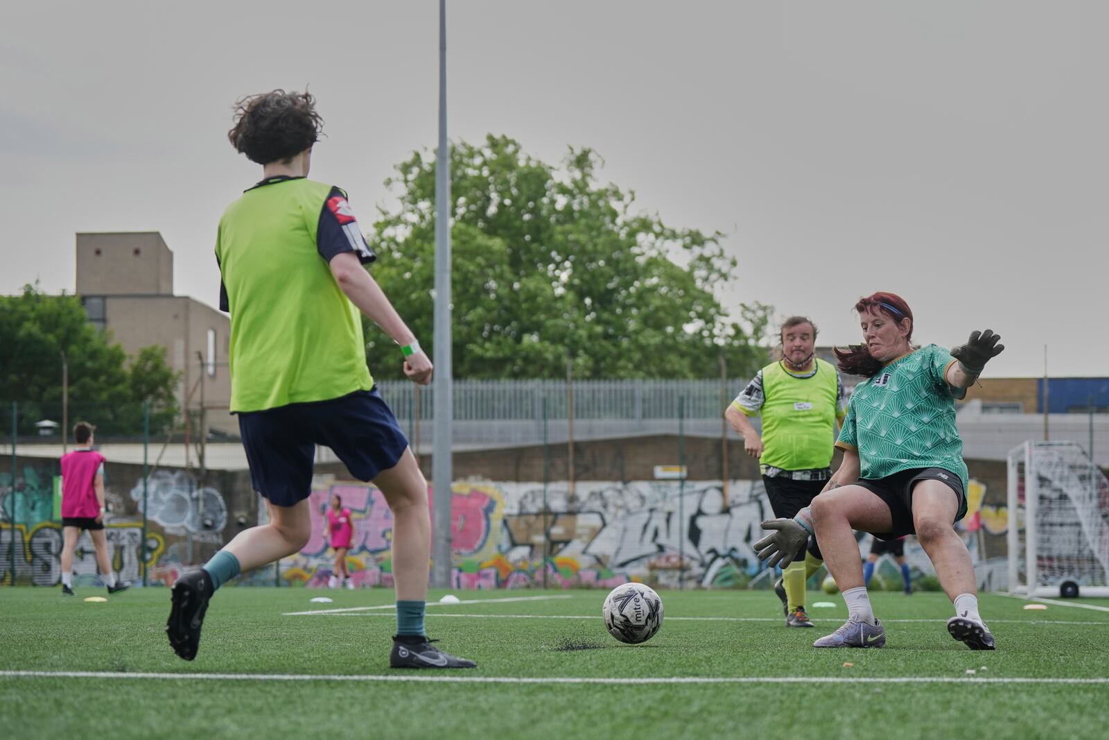 Paula Griffin, right attempt to make a save during an inclusive six a side soccer friendly tournament in London, Sunday, June 1, 2025. (AP Photo/Alastair Grant)