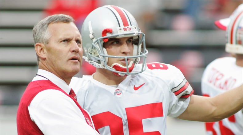 RALEIGH, NC - SEPTEMBER 18: Head coach Jim Tressel of the Ohio State Buckeyes talks with kicker Mike Nugent #85 during the game against the North Carolina State Wolfpack on September 18, 2004 at Carter-Finley Stadium Stadium in Raleigh, North Carolina. (Photo by Grant Halverson/Getty Images) *** Local Caption *** Jim Tressel;Mike Nugent