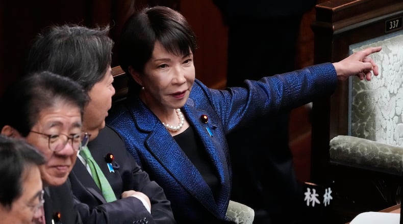Japan's Prime Minister Sanae Takaichi, center, attends a special session of the lower house in Tokyo, Japan, Wednesday, Feb. 18, 2026. (AP Photo/Eugene Hoshiko)