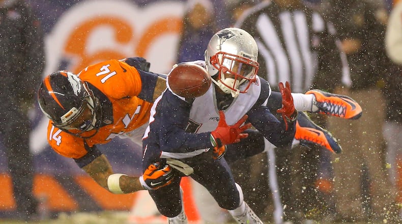 DENVER, CO - NOVEMBER 29: Wide receiver Chris Harper #14 of the New England Patriots fumbles a punt return while wide receiver Cody Latimer #14 of the Denver Broncos tackles in the fourth quarter at Sports Authority Field at Mile High on November 29, 2015 in Denver, Colorado. (Photo by Justin Edmonds/Getty Images)