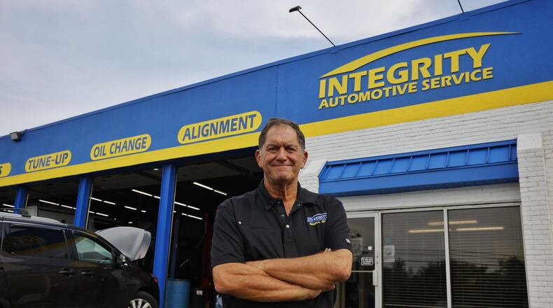 Pete Esposito, owner of Integrity Automotive Service, stands in front of the shop in Middletown. Integrity Automotive is celebrating 25 years in business. NICK GRAHAM/STAFF
