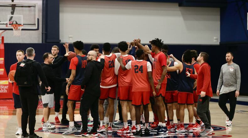 Dayton huddles before practice at the Entertainment and Sports Arena in Washington, D.C., on Thursday, March 10, 2022, one day before playing in the quarterfinals of the Atlantic 10 Conference tournament. David Jablonski/Staff