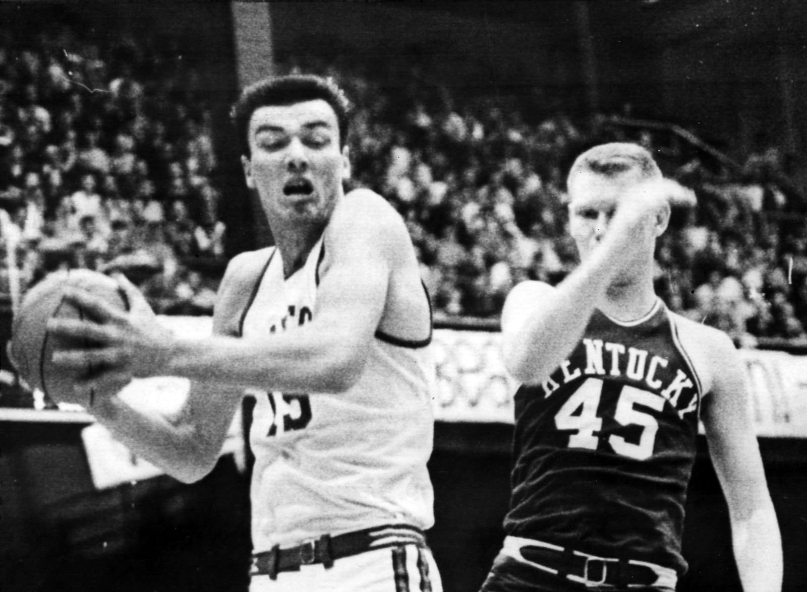 Hank Finkel (left) of the University of Dayton faces Kentucky in a 1966 NCAA tournament regional semifinal in Iowa City, Iowa. DAYTON DAILY NEWS FILE PHOTO