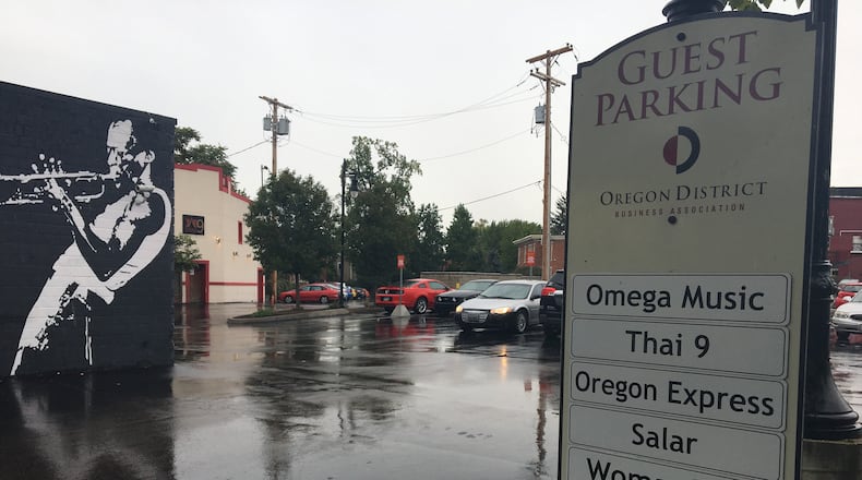 An Oregon District parking lot will begin charging customers for parking for certain times of the day. STAFF/CORNELIUS FROLIK