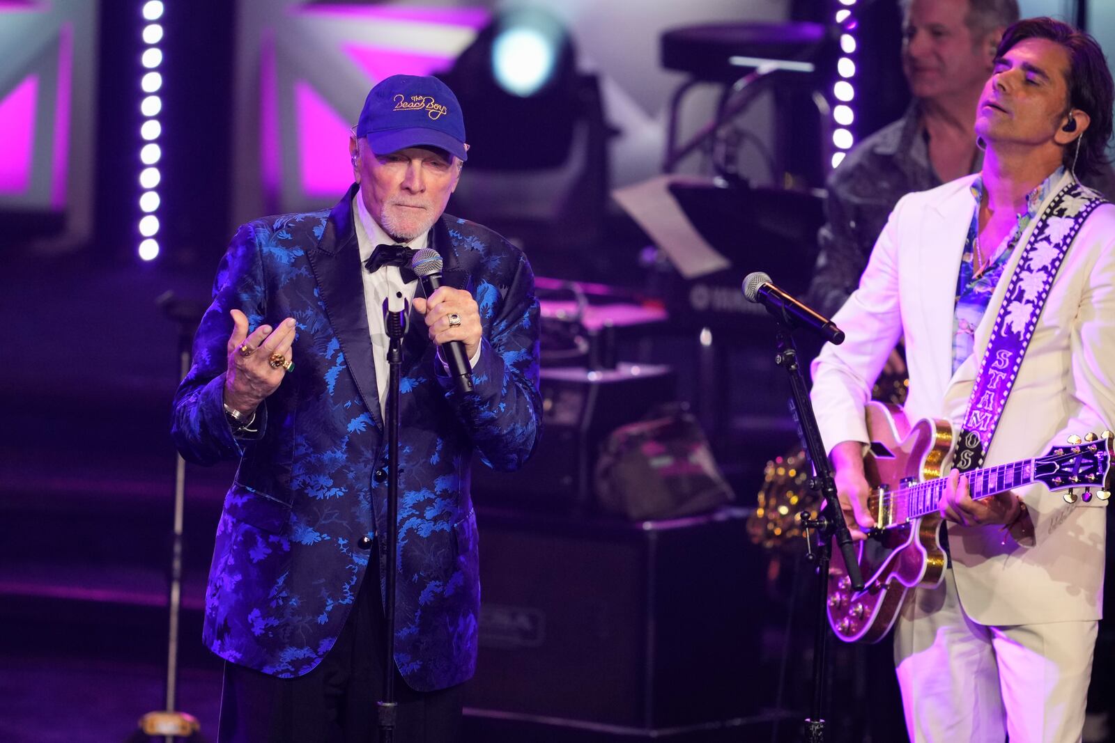 Mike Love, left, and John Stamos perform during the 54th annual Songwriters Hall of Fame induction and awards gala on Thursday, June 12, 2025, at the Marriott Marquis Hotel in New York. (Photo by Charles Sykes/Invision/AP)