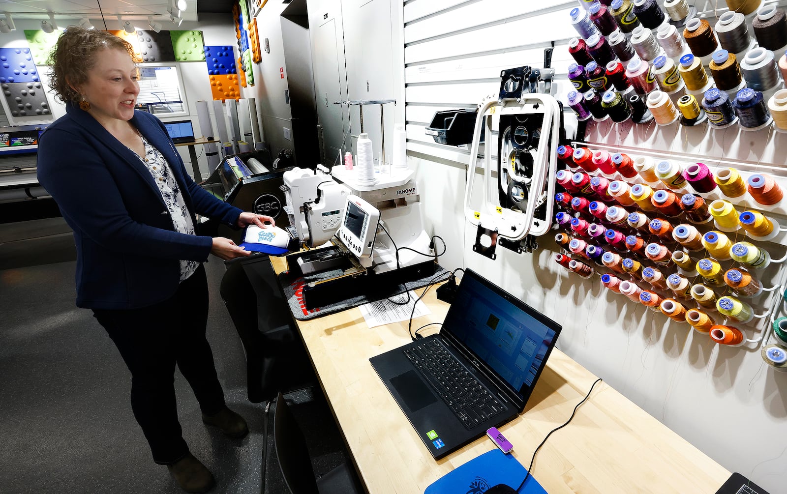 Makerspace manager Cara Kouse shows off Spark Place equipment, February 12, 2025. The recent renovations to the Xenia Community Library has doubled the size of Spark Place, the library's makerspace. MARSHALL GORBY\STAFF