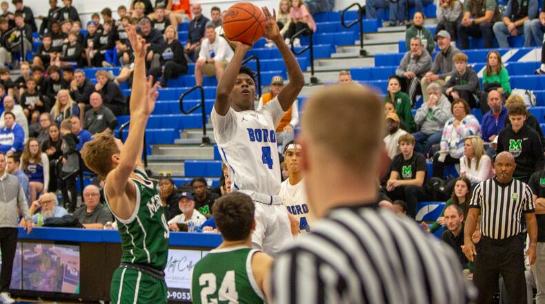 Springboro junior Will Yates shoots during Tuesday's game against Mason. CONTRIBUTED/Jeff Gilbert