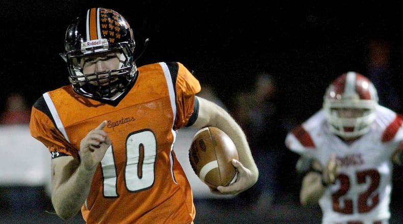 E.L. Hubbard photography Waynesville quarterback Luke Creditt runs for a touchdown against Milton-Union in the first half at Waynesville Friday, Oct. 21, 2011.
