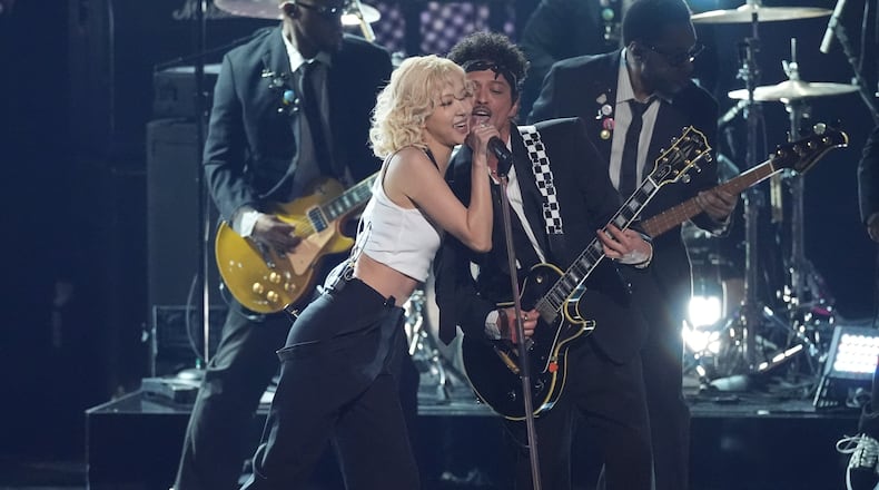 Rose, left, and Bruno Mars perfom "APT." during the 68th annual Grammy Awards on Sunday, Feb. 1, 2026, in Los Angeles. (AP Photo/Chris Pizzello)