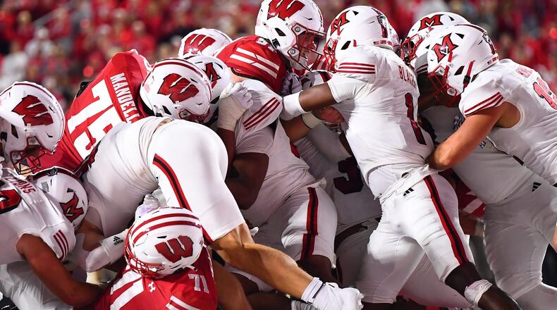 The Miami defense stops a Wisconsin goal line run play during their game on Thursday, Aug. 28 at Camp Randall Stadium in Madison, Wisc. KYLE HENDRIX / CONTRIBUTED