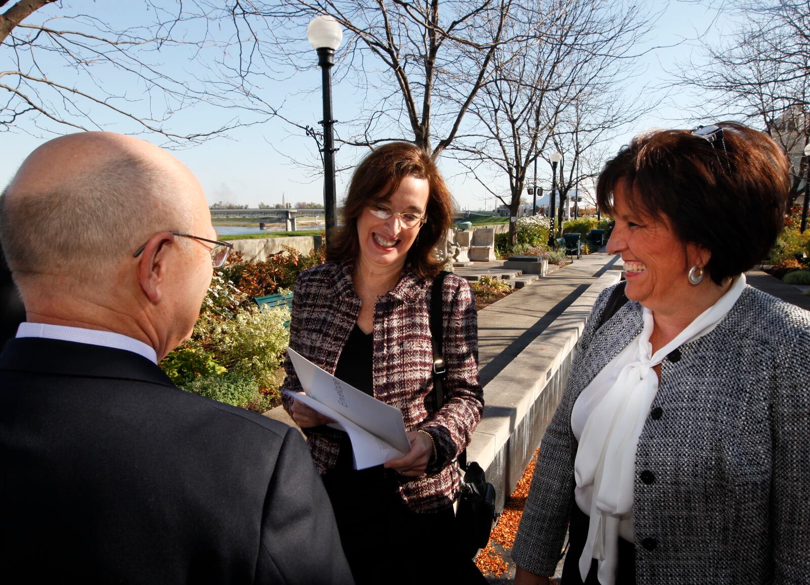 Julia Wallace, Cox Media Group Ohio market vice president, shows the $1 million check from the James M. Cox Foundation to Dr. Mike Ervin, co-chair of the Greater Downtown Dayton Plan, and Sandy Gudorf, Downtown Dayton Partnership president, before an announcement that the RiverScape River Run project reached its fundraising goal of $4 million. STAFF PHOTO BY CHRIS STEWART