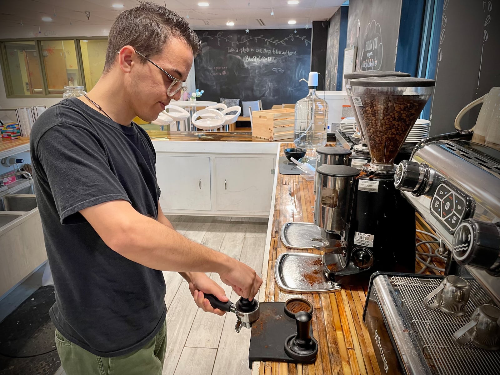 Blue Sky Coffee, a coffee shop and creative space, is located across from Wright State University in the Emergence Center at 3070 Presidential Drive. Matthew Stevenson (pictured) owns the coffee shop with his wife, Elisa. NATALIE JONES/STAFF