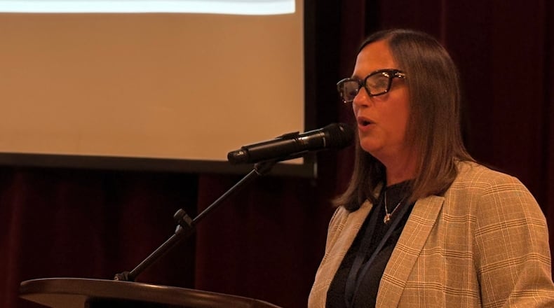 Kettering City Schools Superintendent Mindy McCarty-Stewart presents the consolidation and school construction plan during a community forum Wednesday, Oct. 15, 2025, at Van Buren Middle School. JEN BALDUF/STAFF