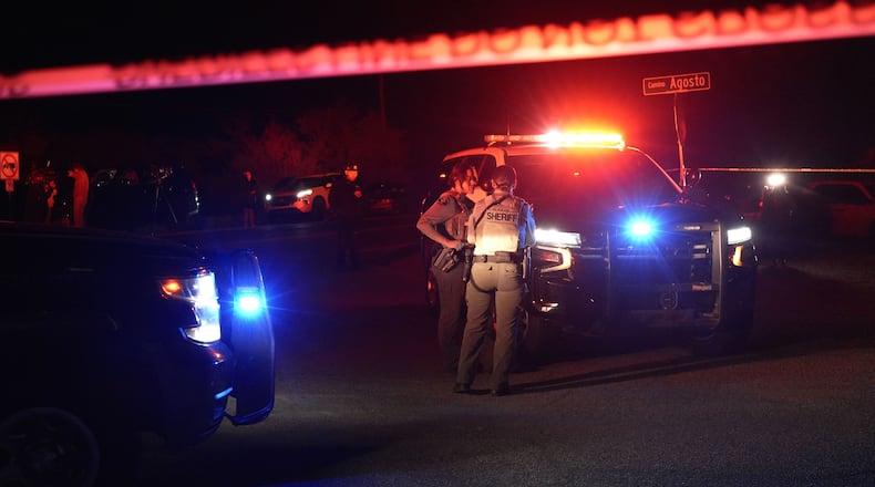 Sheriff's officials block the entrance to a road where a home was being searched in Rio Rico, Arizona, on Tuesday, Feb. 10, 2026, in connection to the investigation of Nancy Guthrie's disappearance. (AP Photo/Ty ONeil)