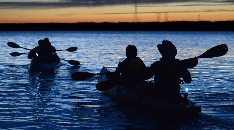 From left, Lee Sutton and Amanda Grim take an evening kayak trip through the Delta with Mike Sutton and Sandy Sutton after having dinner at the Garlic Brothers restaurant, located at the Village West Marina, in Stockton, Calif., on June 8, 2016. Stockton’s many marinas are a perfect jumping off point for all sorts of aquatic fun, from houseboating to kayaking, waterskiing, personal watercraft, and otherwise paddling about. (Doug Duran/Bay Area News Group/TNS)