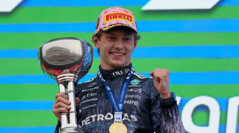 Mercedes driver Kimi Antonelli of Italy reacts on the podium after winning the Japanese Formula One Grand Prix at Suzuka in central Japan, Sunday, March 29, 2026. (AP Photo/Eugene Hoshiko)