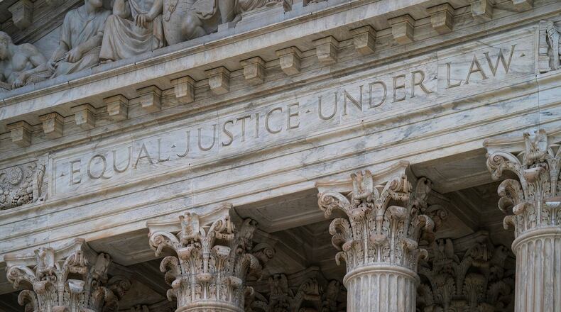 FILE - The west facade of the Supreme Court Building bears the motto "Equal Justice Under Law" on March 20, 2019, in Washington. (AP Photo/J. Scott Applewhite, File)