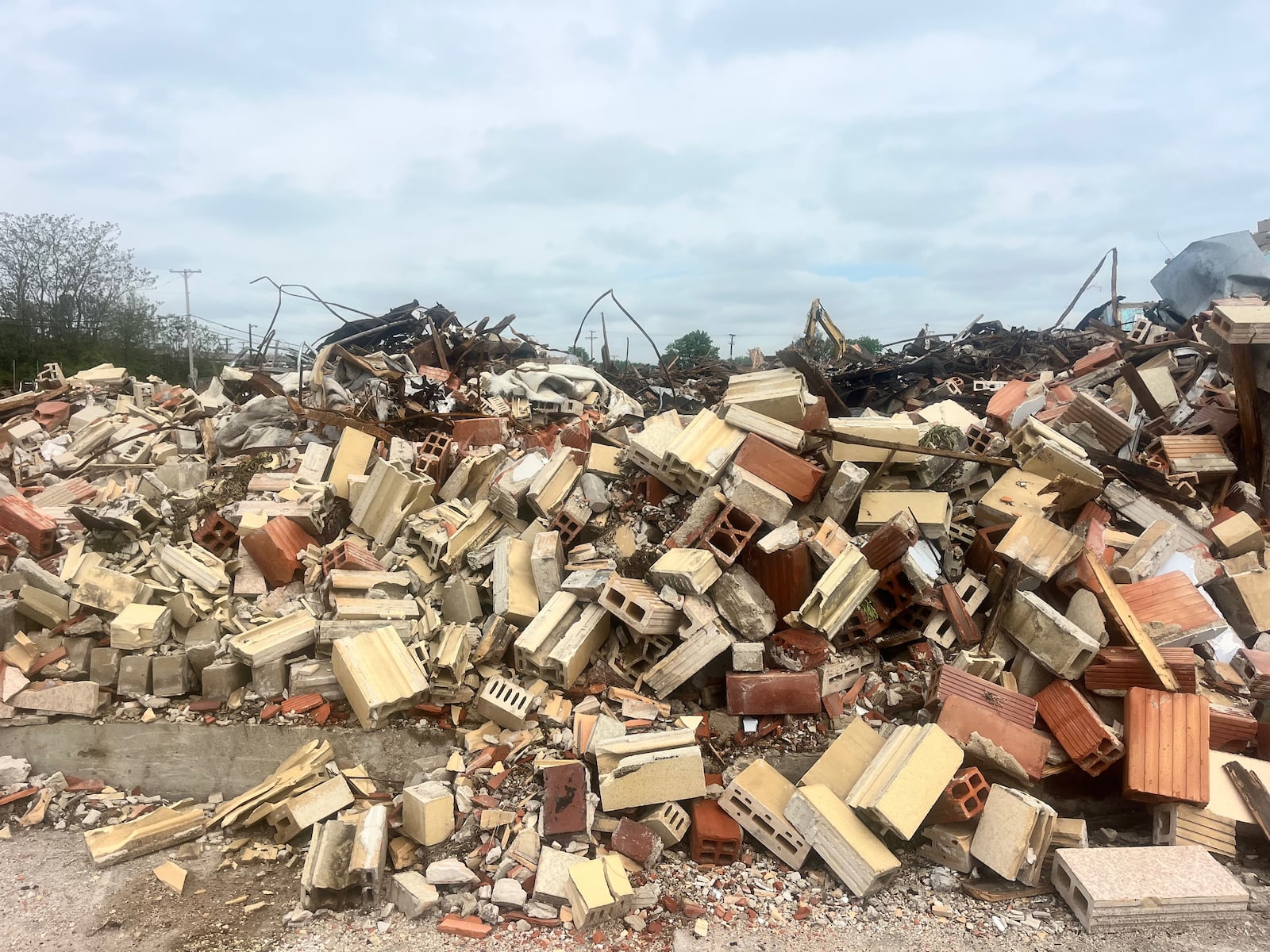 Debris from the demolition of McCook Bowl on Keowee Street in Dayton is pictured on Thursday, May 8, 2025. David Jablonski/Staff