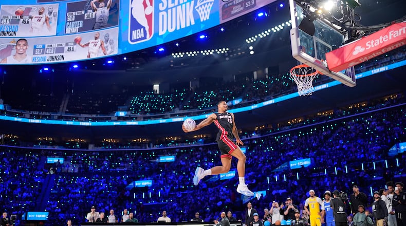 Miami Heat forward Keshad Johnson dunks during the slam dunk contest at the NBA basketball All-Star weekend festivities Saturday, Feb. 14, 2026, in Inglewood, Calif. (AP Photo/Mark J. Terrill)