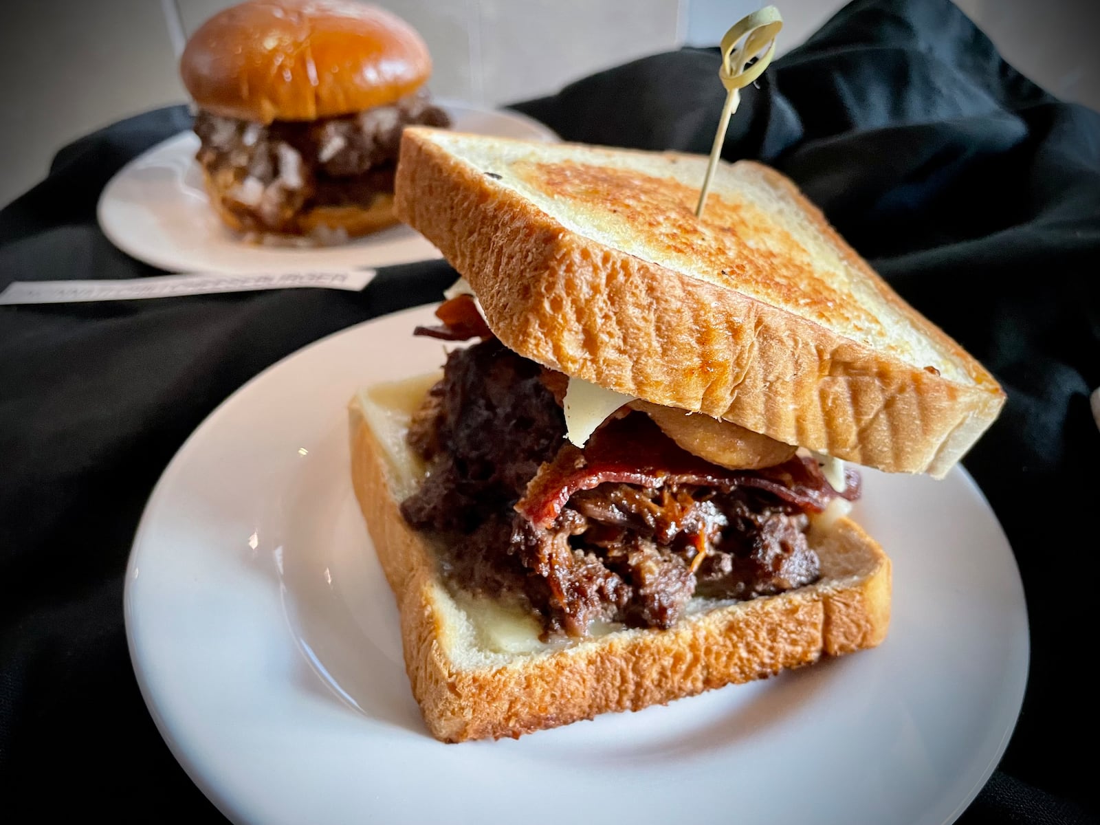 CMX CinéBistro at the Liberty Center has launched a new menu offering elevated theater food and snacks. Pictured is the braised short rib rodeo burger. NATALIE JONES/STAFF