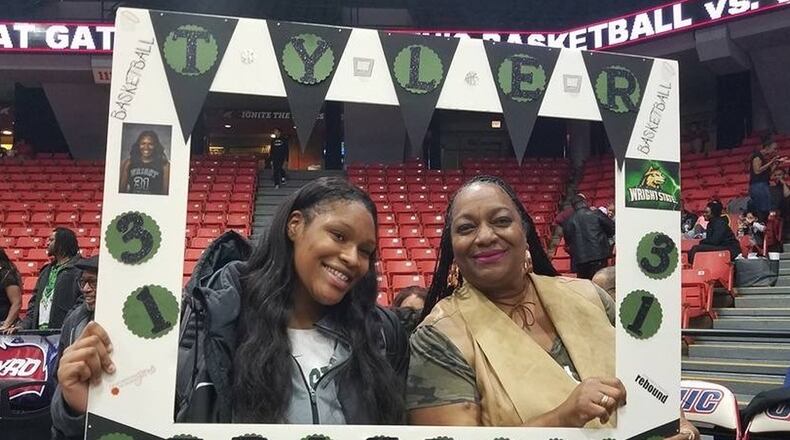 Wright State women’s basketball player Tyler Frierson and her mom, Andrea (right) at a late December game at UIC this season. CONTRIBUTED
