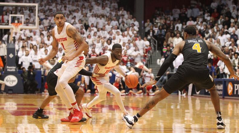 Dayton’s Jalen Crutcher dribbles against Virginia Commonwealth on Saturday, Feb. 16, 2019, at UD Arena. David Jablonski/Staff