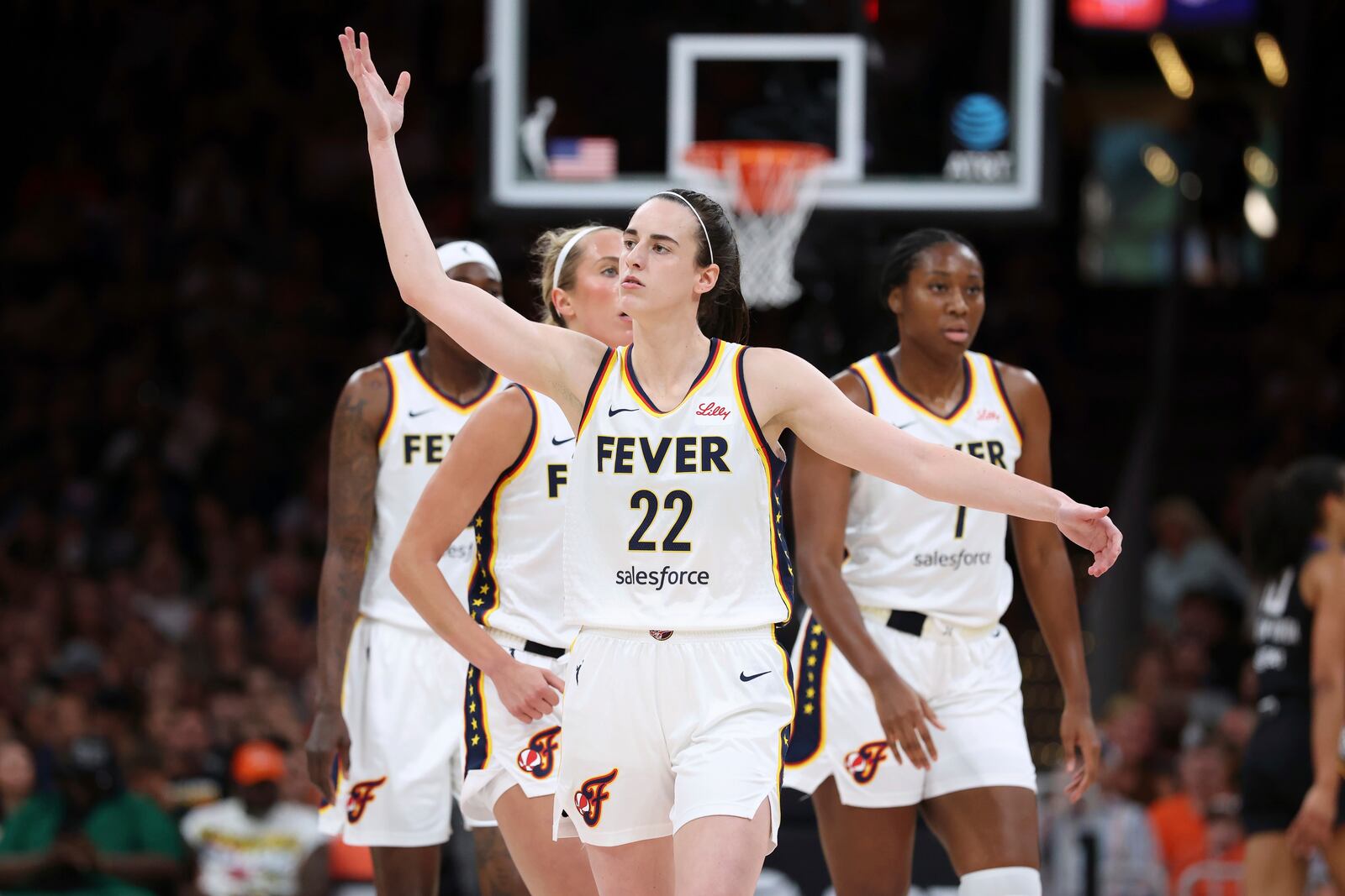 Indiana Fever's Caitlin Clark (22) gestures to the crowd during the first half of a WNBA basketball game against the Connecticut Sun Tuesday, July 15, 2025, in Boston. (AP Photo/Michael Dwyer)
