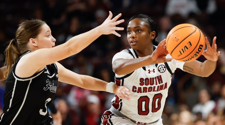 South Carolina guard Ta'Niya Latson (00) passes against Providence guard Orlagh Gormley during the first half of an NCAA college basketball game in Columbia, S.C., Sunday, Dec. 28, 2025. (AP Photo/Nell Redmond)