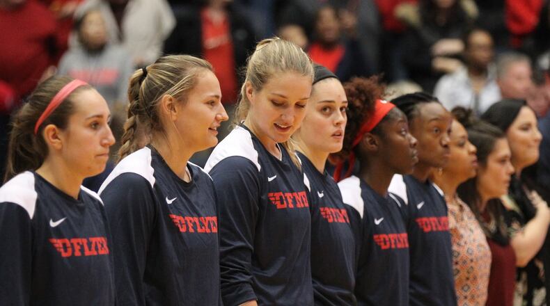 Dayton players stand for the national anthem before a game against Colgate on Nov. 9, 2018, at UD Arena. David Jablonski/Staff